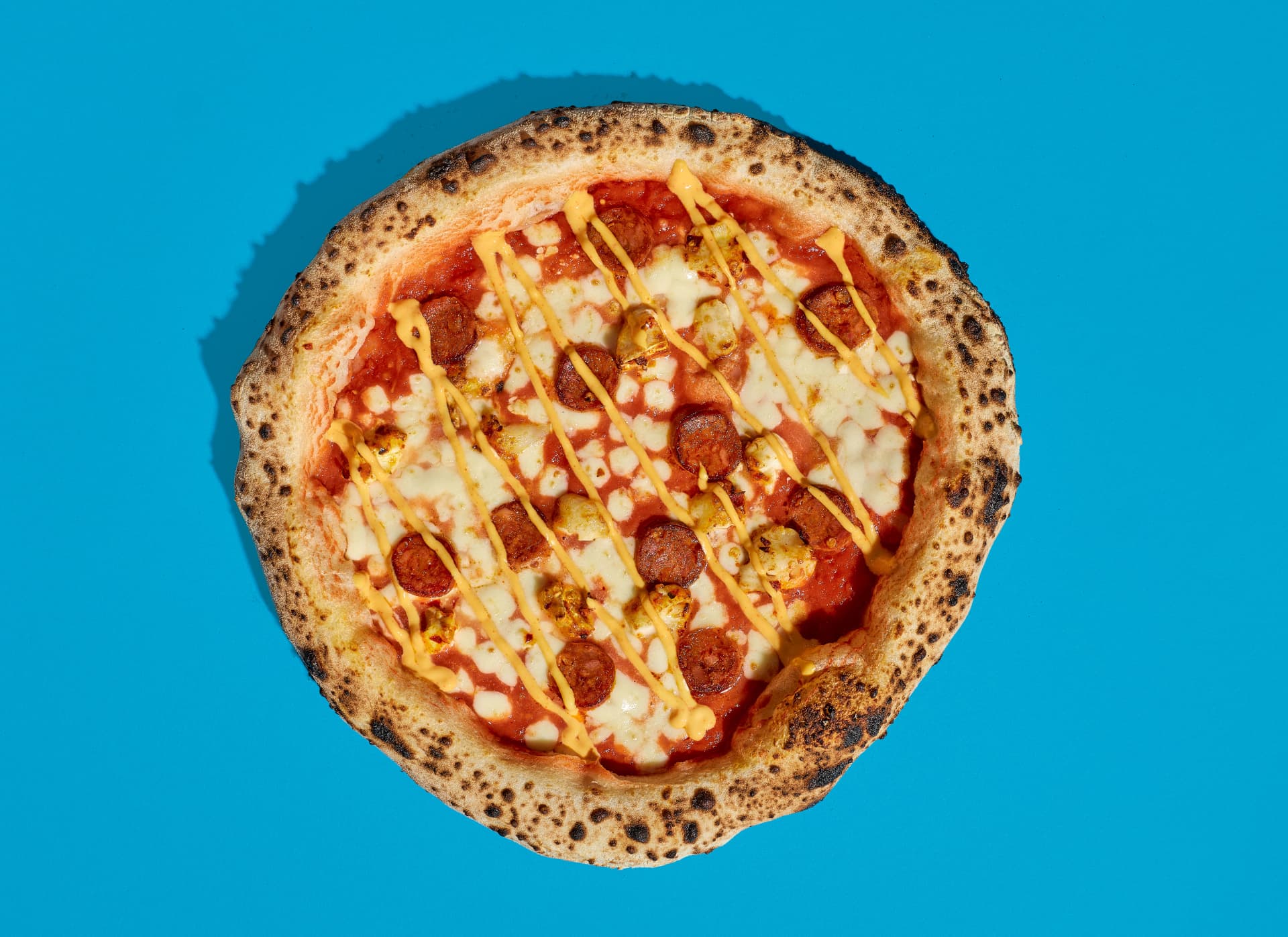 Brindisa chorizo sourdough pizza with chorizo, goat's cheese and sriracha mayo